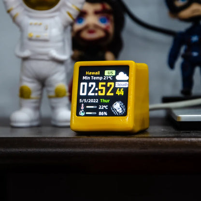 Smart  Desktop Clock Electronic - Weather Station yellow on wooden desk