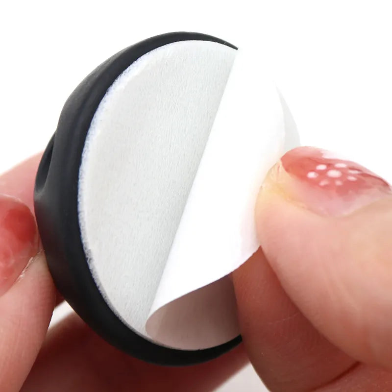 Round Design Silicone USB Cable Organizer back with adhesive tape, close up