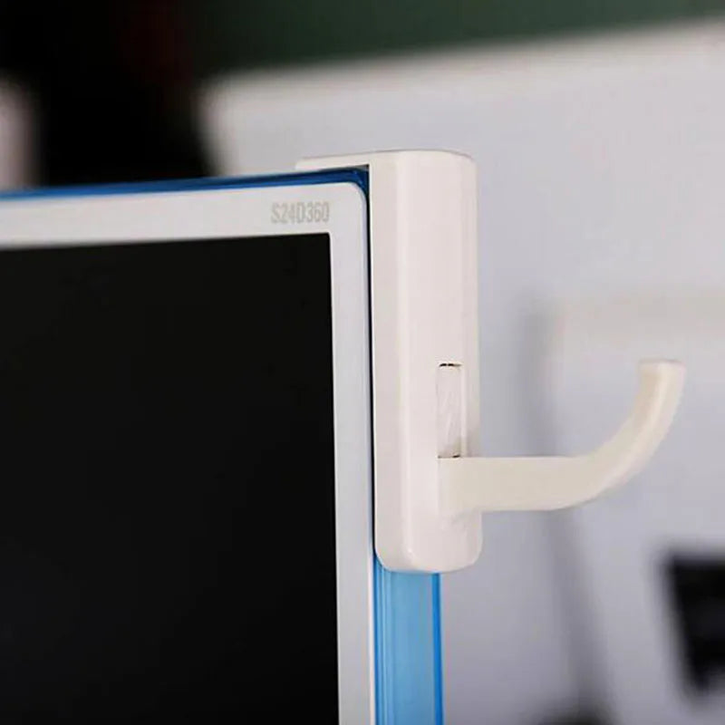 Universal Headphone Headset Hanger in white on the edge of a screen